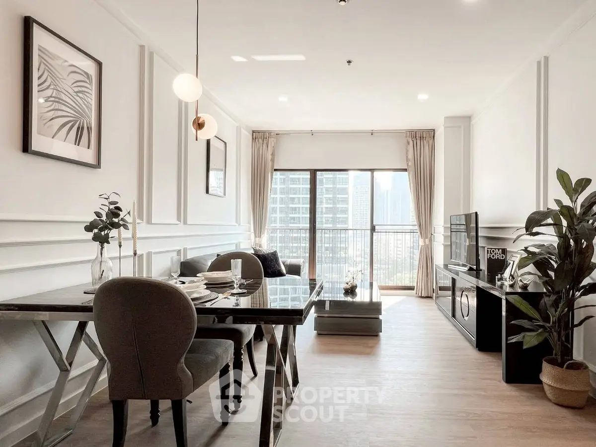 Elegant living room with dining area, modern decor, and city view from large windows.