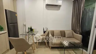 Modern living room with cozy sofa, glass table, and air conditioning in a stylish apartment.