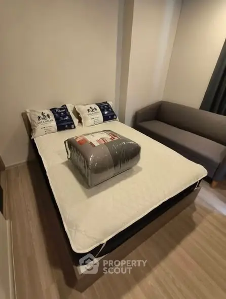 Cozy bedroom with modern furnishings and comfortable bed in a stylish apartment.