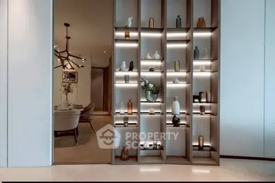 Elegant modern dining area with stylish shelving and ambient lighting
