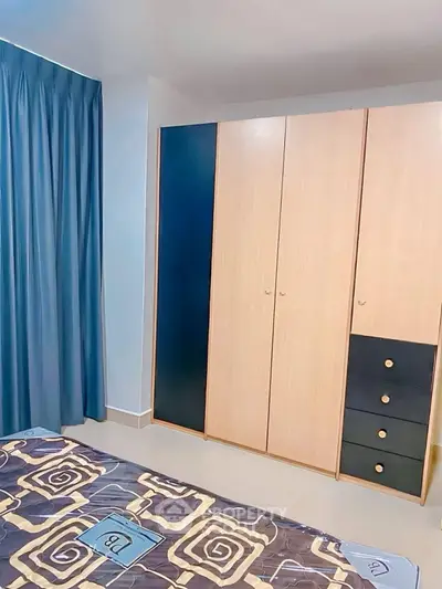 Spacious bedroom with modern wardrobe and stylish decor