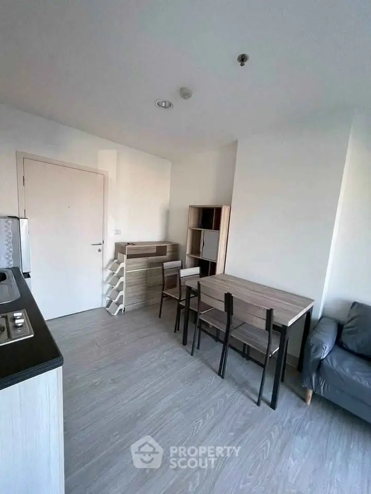 Modern compact living space with dining area and minimalist furniture