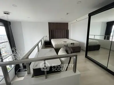 Modern loft bedroom with city view, featuring sleek design and spacious layout.