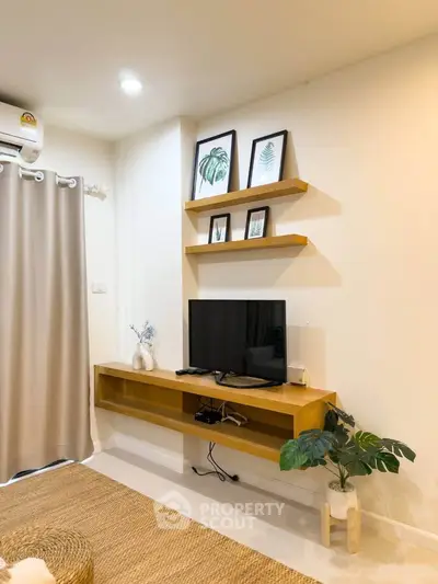 Modern living room with stylish decor and wall-mounted TV unit