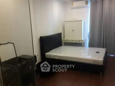 Cozy bedroom with modern furnishings and natural light