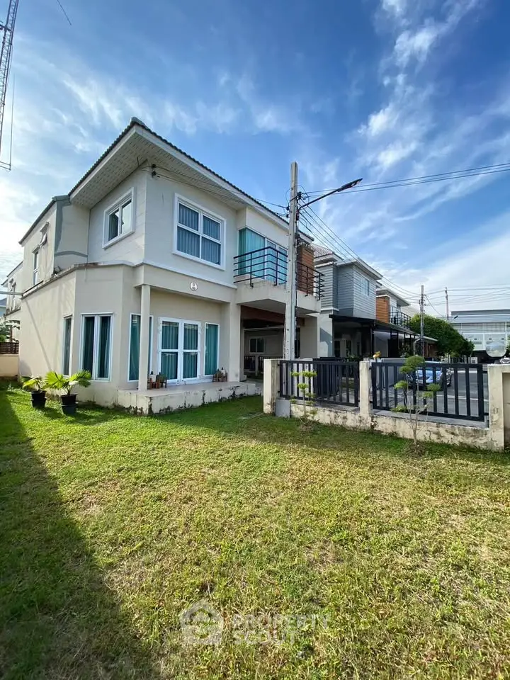 Charming two-story house with spacious front yard and modern design in a serene neighborhood.