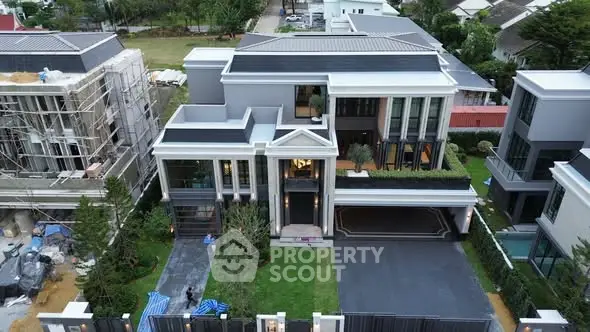 Luxurious modern mansion with grand entrance and landscaped garden