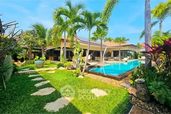 Luxurious tropical villa with private pool and lush garden, perfect for serene living.