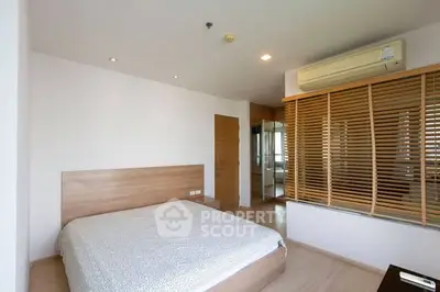 Modern bedroom with wooden accents and air conditioning unit