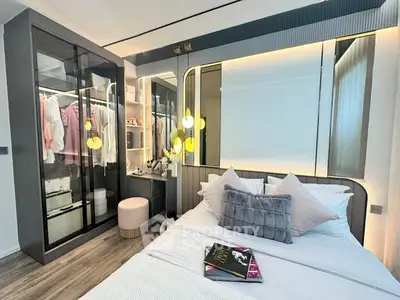 Modern bedroom with stylish decor and built-in wardrobe, featuring elegant lighting and cozy bedding.