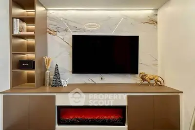 Luxurious living room with modern TV setup and elegant decor