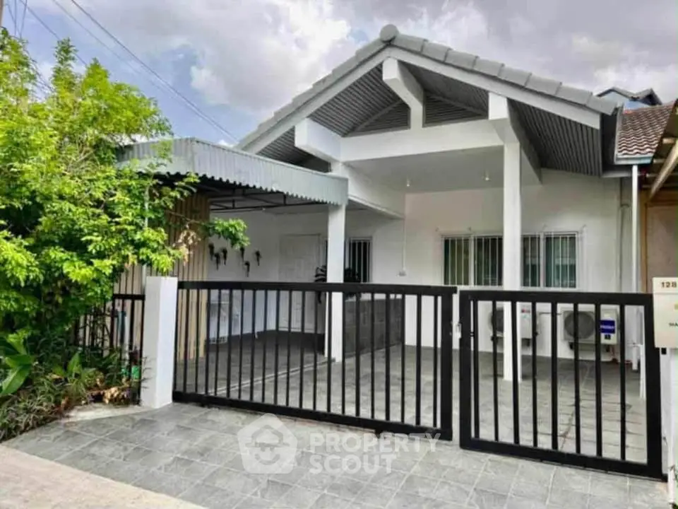 Charming single-story house with modern design and spacious driveway, perfect for family living.