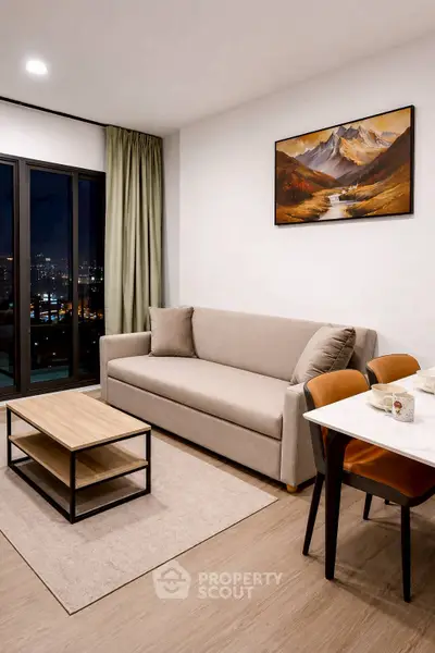 Modern living room with city view, cozy sofa, and elegant decor in a high-rise apartment.