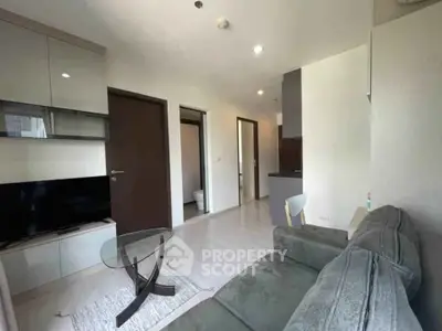 Modern living room with sleek furniture and open layout, perfect for urban living.