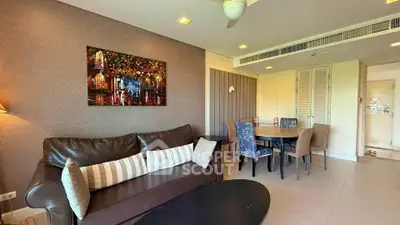 Spacious living room with elegant decor and dining area in modern apartment.