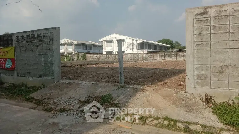 Expansive vacant land ready for development, surrounded by newly constructed homes in a promising neighborhood, ideal for residential projects.
