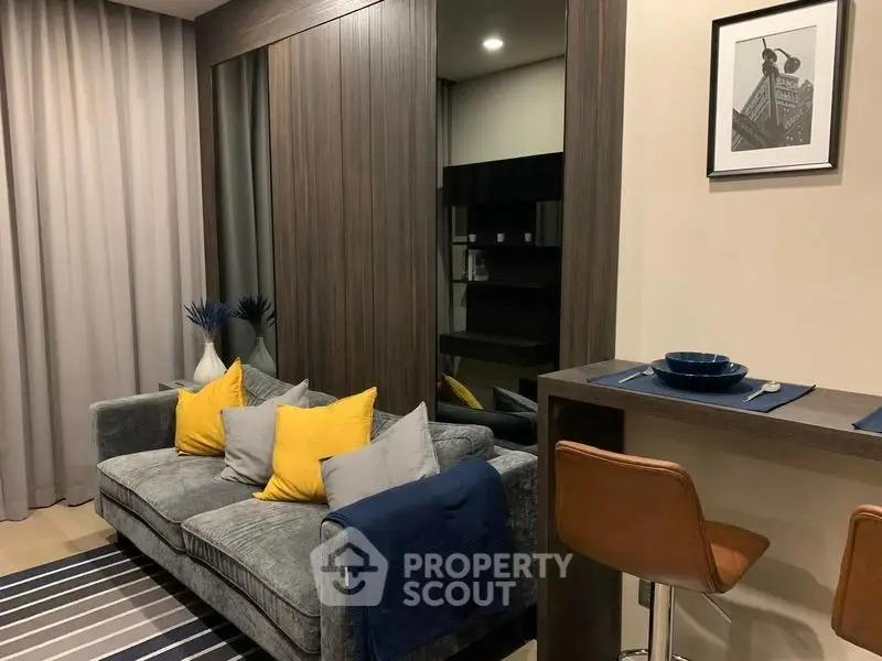 Modern living room with stylish decor and cozy seating area in a contemporary apartment.