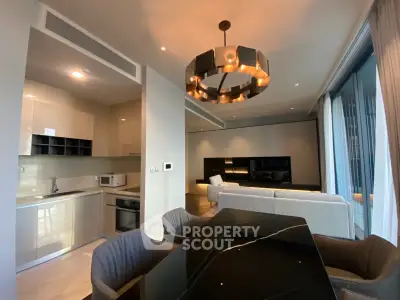 Luxurious modern living room with open kitchen and elegant dining area