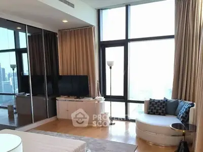 Luxurious living room with floor-to-ceiling windows and modern decor in high-rise apartment.