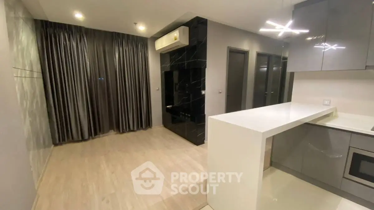 Modern apartment interior with sleek kitchen and spacious living area