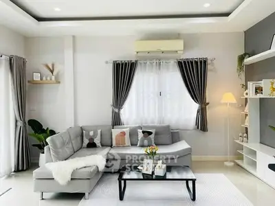 Modern living room with stylish decor and cozy seating area.