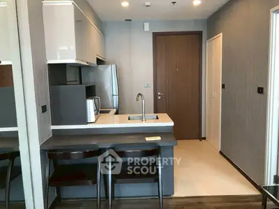 Modern kitchen with sleek design and breakfast bar seating