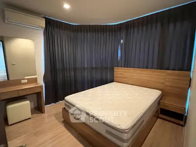 Modern bedroom with wooden furniture and large bed in cozy apartment