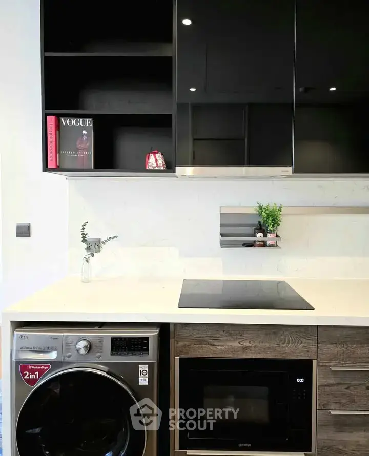 Modern kitchen with sleek appliances and stylish cabinetry