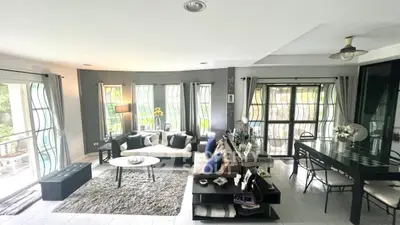 Spacious modern living room with large windows and stylish decor