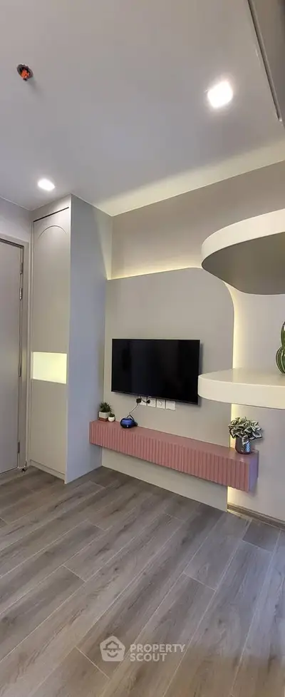 Modern living room with sleek TV setup and stylish decor