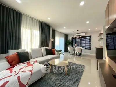 Modern living room with elegant decor and cozy dining area