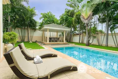 Luxurious backyard with a sparkling pool, lush greenery, and a stylish gazebo for outdoor relaxation.