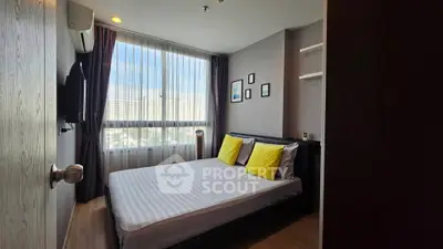 Modern bedroom with large window and stylish decor in urban apartment