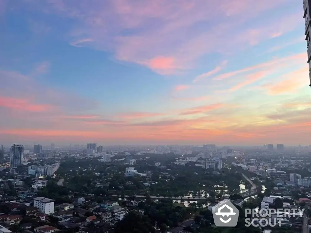 Stunning cityscape view at sunset showcasing urban skyline and vibrant sky colors.