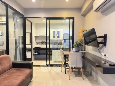 Modern living room with open kitchen and sleek furniture design