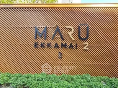 Stylish exterior signage of Maru Ekkamai 2 with modern design elements.