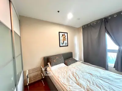 Cozy bedroom with modern decor and ample natural light