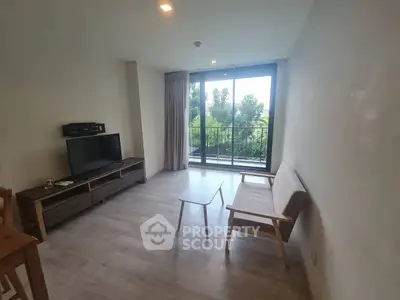 Bright living room with modern furniture and balcony view