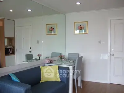 Charming dining area with elegant decor and cozy seating in modern apartment.