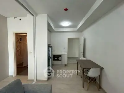 Modern apartment interior with open layout kitchen and dining area.