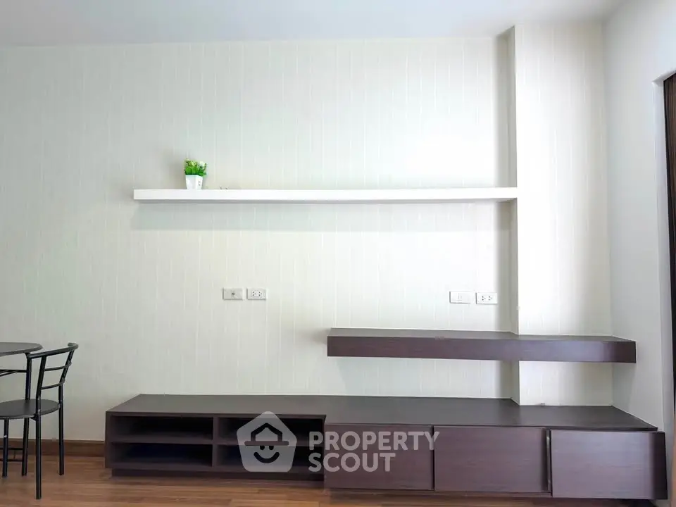 Modern living room with minimalist furniture and wooden flooring