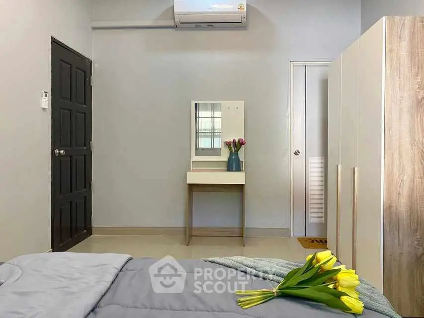 Cozy bedroom with modern decor and air conditioning