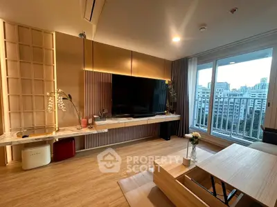 Modern living room with large TV, stylish decor, and city view from balcony.