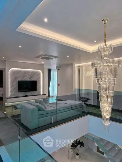 Luxurious modern living room with elegant chandelier and stylish decor