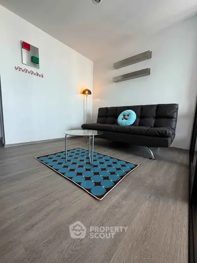 Modern living room with stylish decor and comfortable seating in a contemporary apartment.