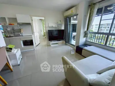 Modern living room with open kitchen and large window view