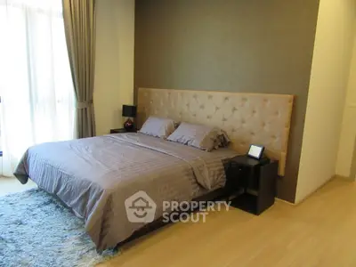 Luxurious bedroom with elegant decor and plush bedding in modern apartment
