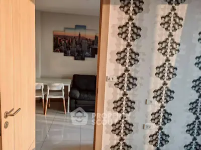 Modern interior with geometric wallpaper and stylish furniture in a cozy living space.