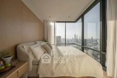Luxurious bedroom with panoramic city views and elegant decor