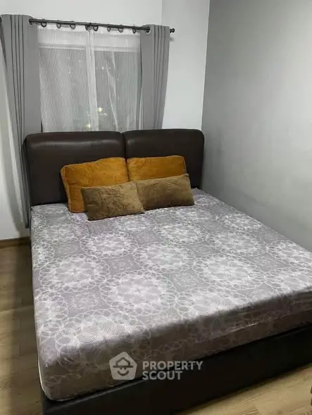 Cozy bedroom with modern decor and comfortable bed in a stylish apartment.